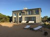 Modern home with Outdoor and Front Yard. Front Elevation facing the beach Photo of Casa Sienna