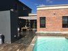 Modern home with Outdoor, Wood Patio, Porch, Deck, Back Yard, Tile Patio, Porch, Deck, Concrete Pools, Tubs, Shower, Vertical Fences, Wall, Swimming Pools, Tubs, Shower, Stone Patio, Porch, Deck, Wood Fences, Wall, and Large Patio, Porch, Deck. Courtyard & Pool Photo 4 of Casa Sienna