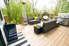 Elevated back deck, with concrete below accessible with barn doors for additional exterior storage Photo 4 of The Sangar House modern home