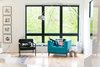 Uncovered windows in the living room gain privacy with the surrounding trees Photo 12 of The Sangar House modern home