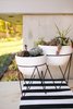 Front porch planters with mid-century modern inspired chevron base Photo 15 of The Sangar House modern home