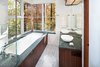 Modern home with Bath Room, Granite Counter, Limestone Floor, Concrete Floor, Drop In Sink, Undermount Tub, Open Shower, Ceiling Lighting, Wall Lighting, Recessed Lighting, Subway Tile Wall, and One Piece Toilet. Master Bath Photo 8 of Home for Sale: Takoma Park House