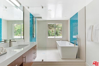 Love the tile, and great solution for a small space - put the tub in the shower ! 
