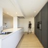 Modern home with Kitchen, Light Hardwood Floor, Refrigerator, Laminate Cabinet, Microwave, Dishwasher, Wall Oven, Granite Counter, Ceramic Tile Backsplashe, and Ceiling Lighting. 038.PEDRO RICO - Kitchen Photo of 038.PEDRO RICO