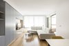 Modern home with Living Room, Table, Chair, Storage, Light Hardwood Floor, Ceiling Lighting, Coffee Tables, Bookcase, Sofa, and Media Cabinet. Living room Photo 7 of 010.MS51