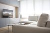 Modern home with Living Room, Ceiling Lighting, Storage, Sofa, Shelves, Bookcase, Light Hardwood Floor, Media Cabinet, and Coffee Tables. Living room Photo 9 of 010.MS51