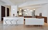 Modern home with Kitchen, Range, White Cabinet, Range Hood, Metal Backsplashe, Wood Cabinet, Undermount Sink, Light Hardwood Floor, Engineered Quartz Counter, Pendant Lighting, Recessed Lighting, and Microwave. Kitchen Photo 4 of Tribeca Loft