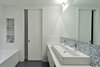 Modern home with Bath Room, Porcelain Tile Floor, Vessel Sink, Ceramic Tile Wall, Alcove Tub, Wall Lighting, and Engineered Quartz Counter. Bathroom Photo 8 of Tribeca Loft