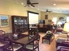 Modern home with Living Room, Recessed Lighting, Carpet Floor, Bookcase, and Ceiling Lighting. Family and dining room Photo 4 of Barn House