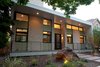 Modern home with Outdoor, Front Yard, Flowers, Hardscapes, Boulders, Concrete Patio, Porch, Deck, Decomposed Granite Patio, Porch, Deck, Stone Patio, Porch, Deck, Pavers Patio, Porch, Deck, Horizontal Fences, Wall, and Landscape Lighting. Exterior is split face CMU block, and JamesHardie paneling. Clerestory windows throughout. Photo 4 of The Huff Residence