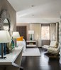 Modern home with Bedroom, Dresser, Bed, Chair, Ceiling Lighting, and Dark Hardwood Floor. Master Bedroom Photo 11 of Donner Residence