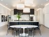 Modern home with Kitchen, Engineered Quartz Counter, Dark Hardwood Floor, Wood Cabinet, Stone Slab Backsplashe, Pendant Lighting, Wall Oven, Refrigerator, and Undermount Sink. Kitchen and Dining Area
Photo 8 of Donner Residence