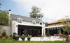 Modern home with Outdoor, Trees, Large Patio, Porch, Deck, and Back Yard. Rear Elevation. Dining/Living Addition in front of original home. Master Suite addition to the right. Photo 12 of Artist Residence