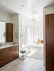 Modern home with Bath Room, Engineered Quartz Counter, Undermount Sink, Porcelain Tile Floor, Open Shower, Alcove Tub, Pendant Lighting, and Stone Tile Wall. Master Bathroom. Photo 11 of Artist Residence