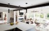 Modern home with Living Room, Chair, Ceiling Lighting, Light Hardwood Floor, and Gas Burning Fireplace. Kitchen with Dining and Living Beyond Photo 6 of Artist Residence