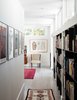 Modern home with Bedroom, Bookcase, Ceiling Lighting, and Light Hardwood Floor. Entry to Master Suite. Custom made steel bookcases. Photo 10 of Artist Residence