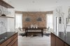Modern home with Dining Room, Chair, Bench, Table, Ceiling Lighting, Pendant Lighting, and Light Hardwood Floor. Dining Room with original exposed brick exterior wall. Photo 4 of Thole Residence