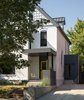 Modern home with Exterior, House Building Type, Metal Roof Material, and Brick Siding Material. Front Entry with new board form wall, and mudroom addition with horizontal siding. Photo 13 of Thole Residence