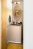 Modern home with Bath Room, Engineered Quartz Counter, Undermount Sink, Ceramic Tile Floor, Wall Lighting, and Stone Slab Wall. Powder Room. Custom Caesarstone wrapped cabinet by Platform Workshop. Heath tile flooring. Photo 8 of Forest Residence