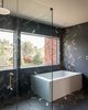 Modern home with Bath Room, Porcelain Tile Floor, and Ceiling Lighting. Master Bathroom. Heath Ceramics wall and floor tile. Photo 15 of Forest Residence
