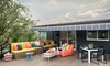 Modern home with Outdoor, Rooftop, Large Patio, Porch, Deck, Trees, Metal Fences, Wall, and Hanging Lighting. Upper roof deck on top of garage. Extendable canopy by Sunbrella. Photo 10 of Forest Residence