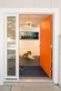 Modern home with Doors, Exterior, Wood, and Swing Door Type. New entry door and entry wall that is part of the pantry beyond. We added the pantry in order to help delineate the entry and create a sense of privacy to the open backyard and dining room beyond. Photo of Langley_Hawthorne Residence