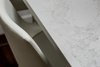 Modern home with Kitchen, Engineered Quartz Counter, and Dark Hardwood Floor. Detail of custom eat-in table and stiched leather stool. Photo 8 of Maplewood Residence
