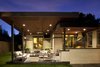 Modern home with Outdoor, Back Yard, and Large Patio, Porch, Deck. Outdoor kitchen and living room expansion. Natural stone wall, concrete floors and countertops, custom built fireplace, and IPE ceilings. Photo of Hudson Patio