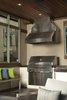 Modern home with Exterior, House Building Type, Metal Roof Material, and Stucco Siding Material. BBQ Area. Concrete countertops and natural stone surround. Photo 2 of Hudson Patio