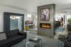 Modern home with Living Room, Sofa, Chair, Ceiling Lighting, Concrete Floor, and Two-Sided Fireplace. Sunken Living Room with See Thru Fireplace Photo 3 of Lawrence Street Residence