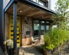 Modern home with Exterior, House Building Type, Metal Roof Material, Wood Siding Material, and Flat RoofLine. Front Patio area with reclaimed tobacco storage wood facade Photo 5 of Lawrence Street Residence