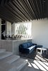 Modern home with Living Room, Sofa, Concrete Floor, and Ceiling Lighting. Dining/living area Photo 4 of The Sleeve House