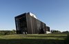 Modern home with Exterior and Wood Siding Material. Front elevation Photo 2 of The Sleeve House