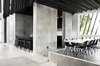 Modern home with Dining Room, Track Lighting, Bar, and Concrete Floor. Breakfast bar/dining area Photo 3 of The Sleeve House