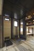 Modern home with Living Room, Bench, Chair, Ottomans, Ceiling Lighting, and Medium Hardwood Floor. Interior Photo 10 of House in Duhanino