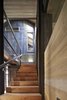 Modern home with Staircase, Metal Railing, and Wood Tread. Interior Photo 12 of House in Duhanino