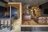 Modern home with Living Room, Sofa, Pendant Lighting, Medium Hardwood Floor, Ceramic Tile Floor, and Bookcase. Living room and kitchen Photo 7 of 57 Drawers