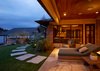 Modern home with Outdoor, Back Yard, Shrubs, Stone Patio, Porch, Deck, Trees, Hardscapes, and Walkways. Back patio feature Restoration Hardware's Costa Luxe collection with view of boat dock and peak into the screened porch Photo of Lake Austin Remodel