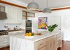 Custom white oak butcher block counters, herringbone Calacatta marble back splash, Calacatta Borgini Gold island with book matched waterfall panels, topped with a pair of Saturno Pendant Lamps by Kazuo Motozawa. Art is original oil on canvas by the client's uncle. Photo 12 of Lake Austin Remodel modern home