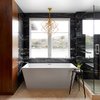 Modern home with Hardscapes, Metal Fences, Wall, Landscape Lighting, Back Yard, Large Patio, Porch, Deck, Ceiling Lighting, Recessed Lighting, Sectional, Coffee Tables, Ottomans, Table, Accent Lighting, Stools, Wood Patio, Porch, Deck, Decking Patio, Porch, Deck, Dresser, Undermount Sink, Alcove Tub, Pendant Lighting, and Subway Tile Wall. Black and gold Zebrino marble clad walls, Egyptian travertine floor tiles, Glacion free standing tub with Waterworks Atlas tub filler, Kelly Wearstler Cubist Chandelier and drinks table by Will Stone. Photo 14 of Lake Austin Remodel
