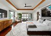 Modern home with Hardscapes, Back Yard, Large Patio, Porch, Deck, Landscape Lighting, Ceiling Lighting, Recessed Lighting, Sectional, Coffee Tables, Metal Fences, Wall, Ottomans, Table, Accent Lighting, Stools, Wood Patio, Porch, Deck, Decking Patio, Porch, Deck, Dresser, Undermount Sink, Two Piece Toilet, Chair, and Gas Burning Fireplace. The Master bedroom featuring a burl wood cabinet by Romweber, custom platform bed, early Milo Baughman chair and ottoman by James Co., opening to the screened porch featuring Restoration Hardware's Costa Luxe double lounger. Over the bed is an original print of David Drebin's Looking Down flanked by a pair of vintage Jo Hammerborg pendant lights. The rug is Moroccan from Black Sheep Unique in Austin, TX. Photo 16 of Lake Austin Remodel