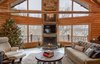 Modern home with Living Room and Gas Burning Fireplace. This install was done by All Seasons Fireplace in Minnesota: “The homeowners loved the original wood burning fireplace, but their contractor suggested that cutting and carrying wood on a daily basis would get old fast, even with four boys at home to help. They wanted to maintain the large viewing area that the wood burning fireplace allowed, so this Trisore 100H gas fireplace model from European Home was the perfect choice for the room.” Photo of Northwoods Log Cabin