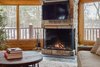 Modern home with Living Room and Gas Burning Fireplace. A contemporary twist on a classic fireplace. Photo 3 of Northwoods Log Cabin