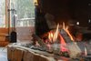 Modern home with Dining Room and Gas Burning Fireplace. The Trisore 100H is thoroughly modern and has a seemingly trimless finish. Photo 6 of Northwoods Log Cabin