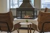Modern home with Dining Room and Gas Burning Fireplace. The dancing flames of the 360 fireplace by Element4. Photo 5 of Flour Bakery