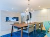 Modern home with Dining Room and Gas Burning Fireplace. The see-through fireplace feature creates enough division between the dining area and living room, while still maintaining an open floor concept Photo 3 of Love It or List It