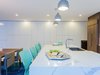 Modern home with Kitchen and Marble Counter. The kitchen now feels modern and clean, with the spacious white marble countertop. Photo 4 of Love It or List It