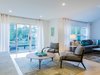 Modern home with Living Room and Gas Burning Fireplace. These mid-century modern chairs add both style and function to the space Photo 6 of Love It or List It