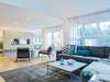 Modern home with Living Room and Gas Burning Fireplace. The living room also uses accents of blue, such as the pillows. Photo 7 of Love It or List It