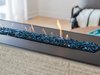 Modern home with Living Room and Gas Burning Fireplace. This chic gas fireplace offers a cozy place for the family to gather, as well as a pop of color with the Pacific Blue fire glass. Photo 5 of Love It or List It